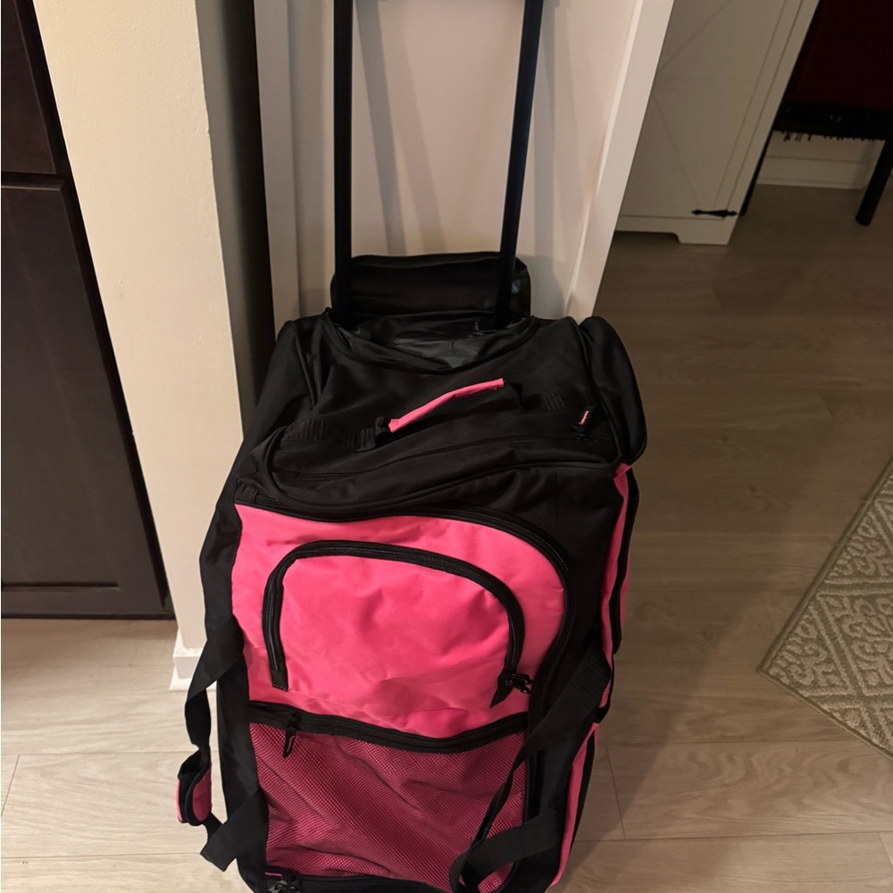 Pink and Black Garment Bag with Wheels

30” long• 16” wide• 14” high
